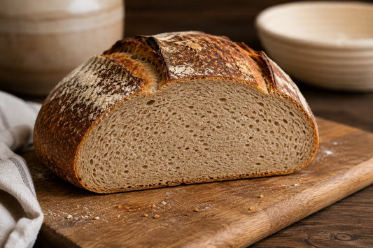 dense sourdough bread loaf sliced open showing tight crumb texture