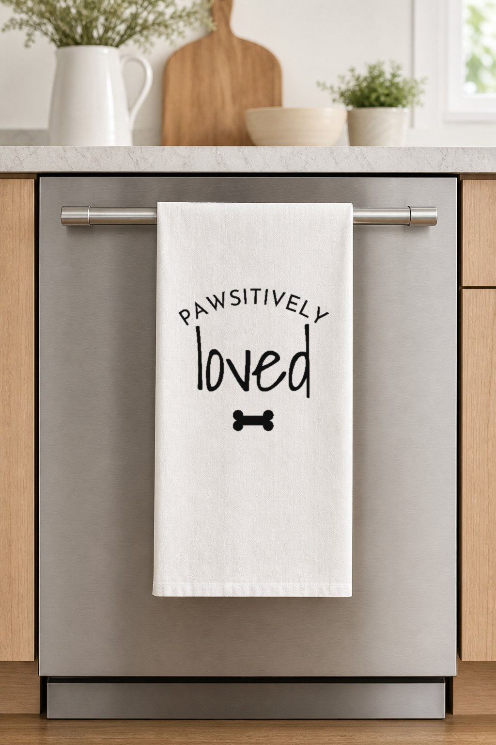PAWSITIVELY loved hand-lettered on a white cotton flour sack tea towel